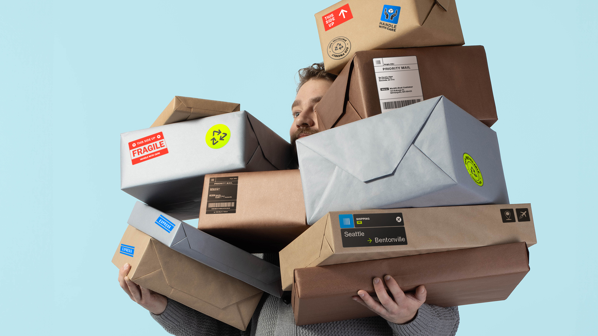 Retail professional carrying a collection of consumer packages